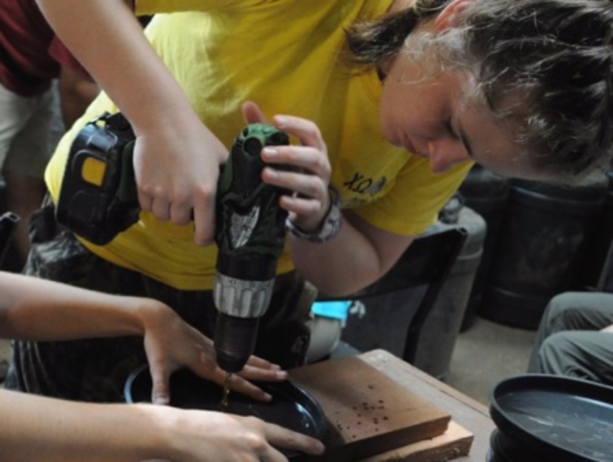 Mercer On Mission Kenya team members work on a system to provide clean drinking water from the Wei Wei River to the center of the community.