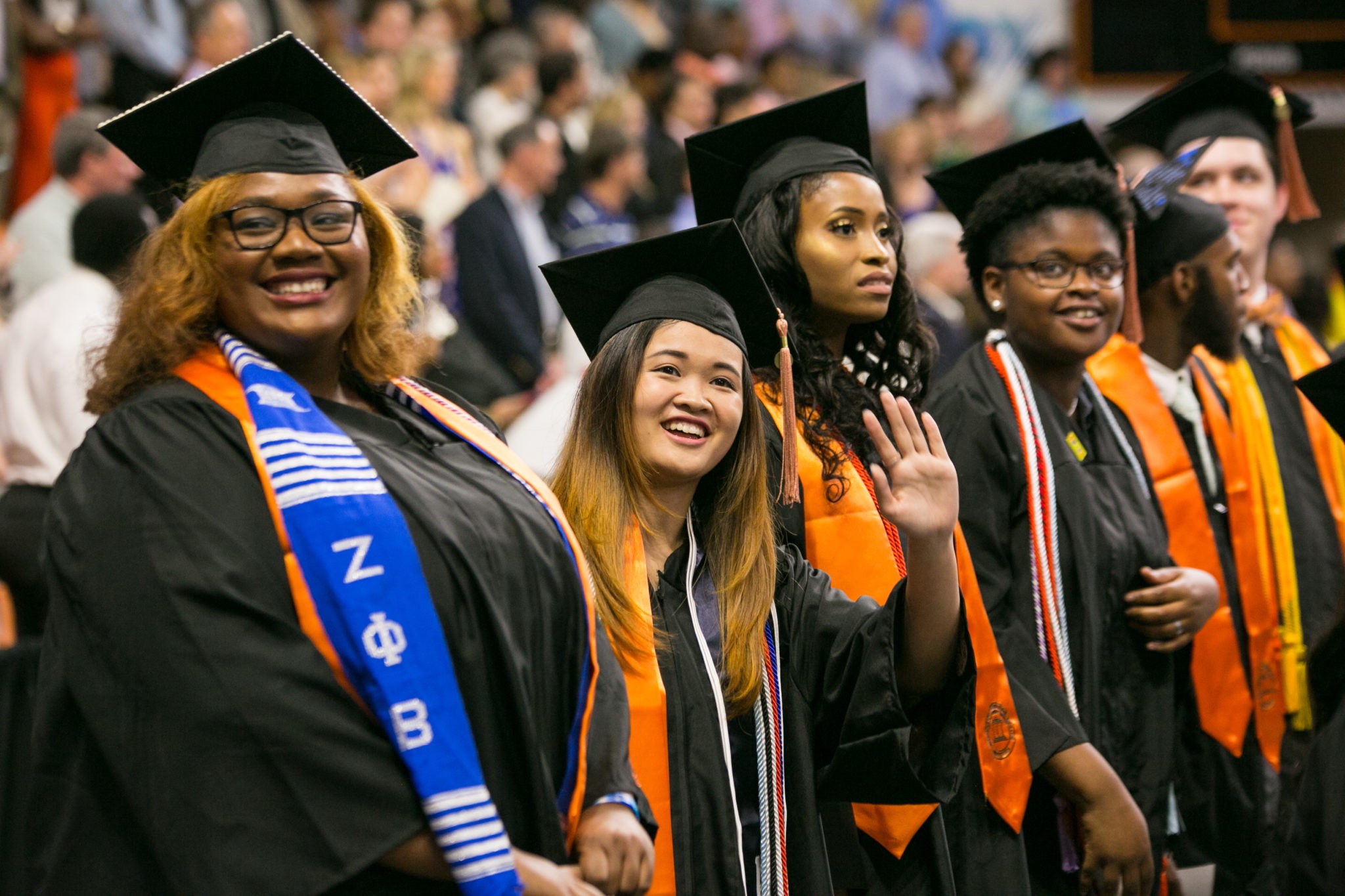 Students are shown in their caps and gown at 2018 commencement in 2018.