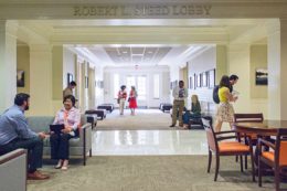 People walk through the Robert Steed Lobby of the Law School.