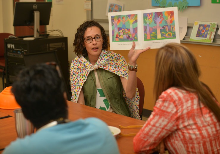 Education student reading book in classroom