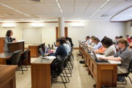 Law students are shown inside a classroom.