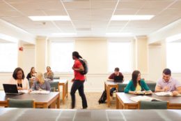 Law students sit at tables to study.