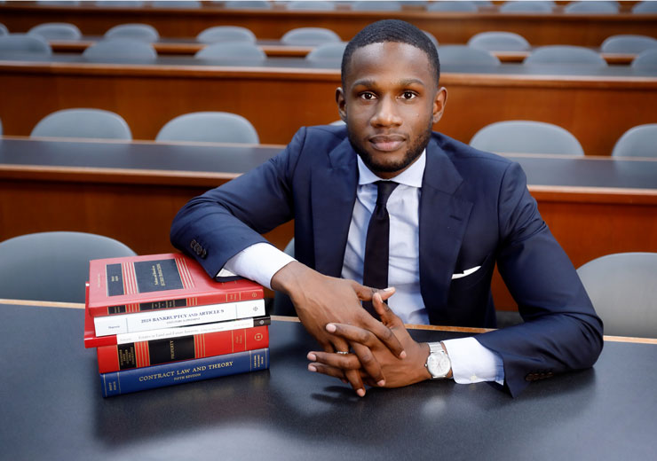 Law student poses with law books