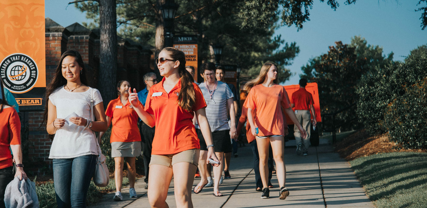 Parents and families walking on campus during a tour