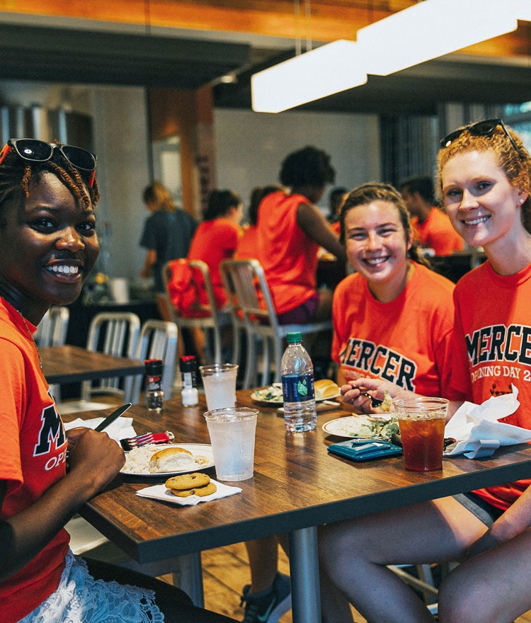 Girls enjoy lunch in the Farmers Market