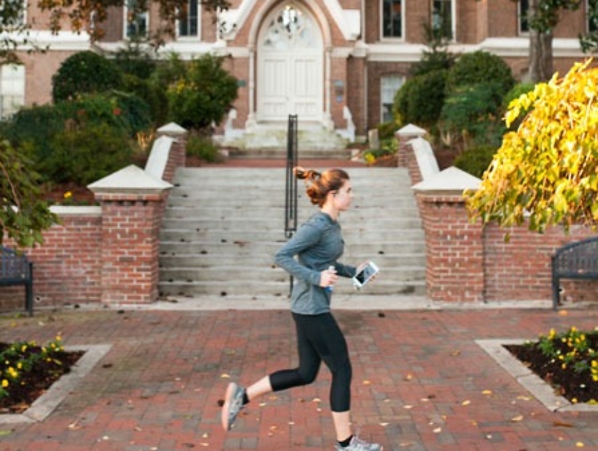Student running on campus