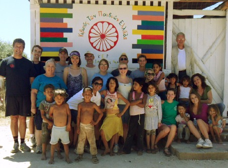 Mercer students pose with community members during a Mercer On Mission trip to Greece.
