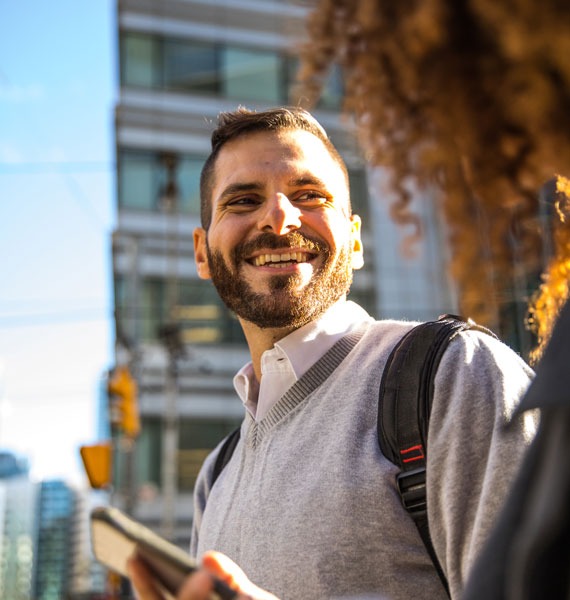 Adult student smiling in city