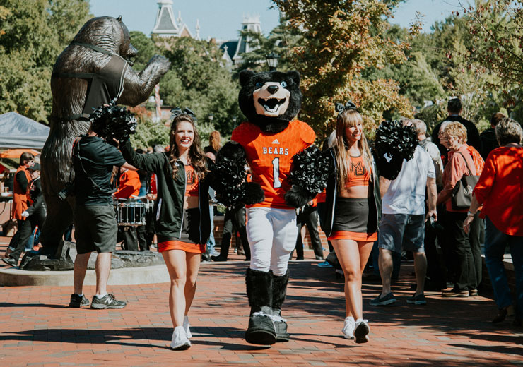 Cheerleaders with Toby during the Bear Walk before a football game