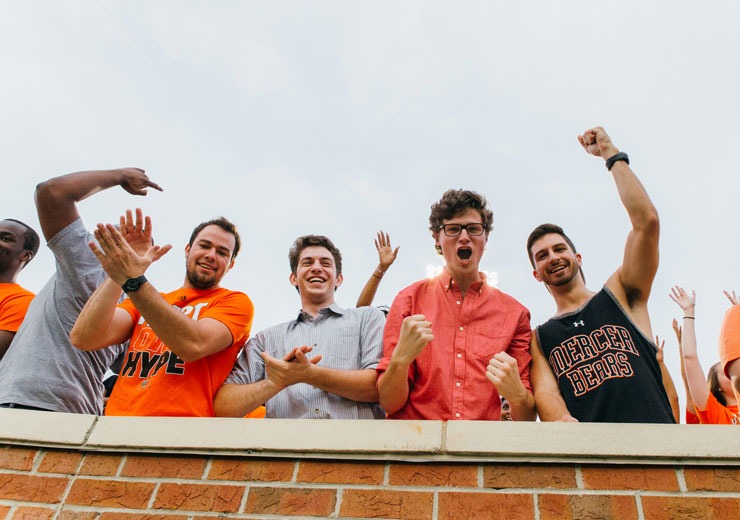 Students cheering in stadium for the Bears