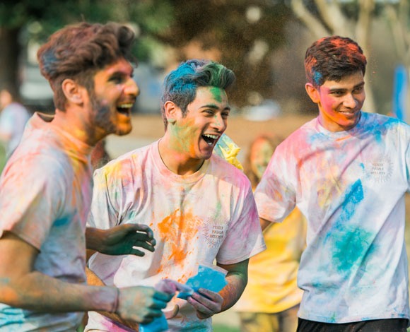 Students participating in Holi Festival