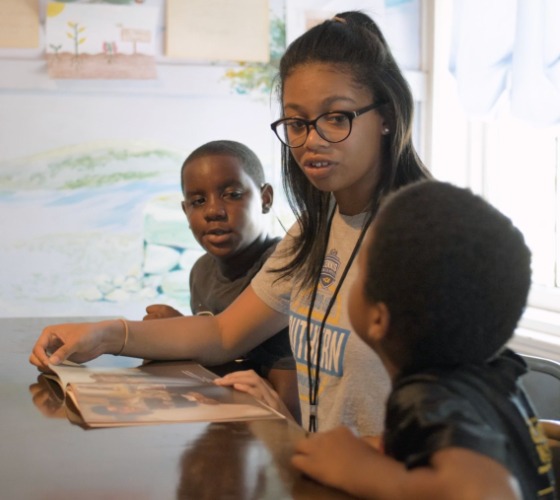 Mercer student NaShaya Bartolo works with kids in Freedom School.