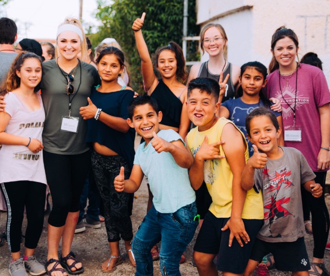 Mercer on Mission students work with kids in Greece.