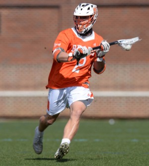 A lacrosse player runs during a game