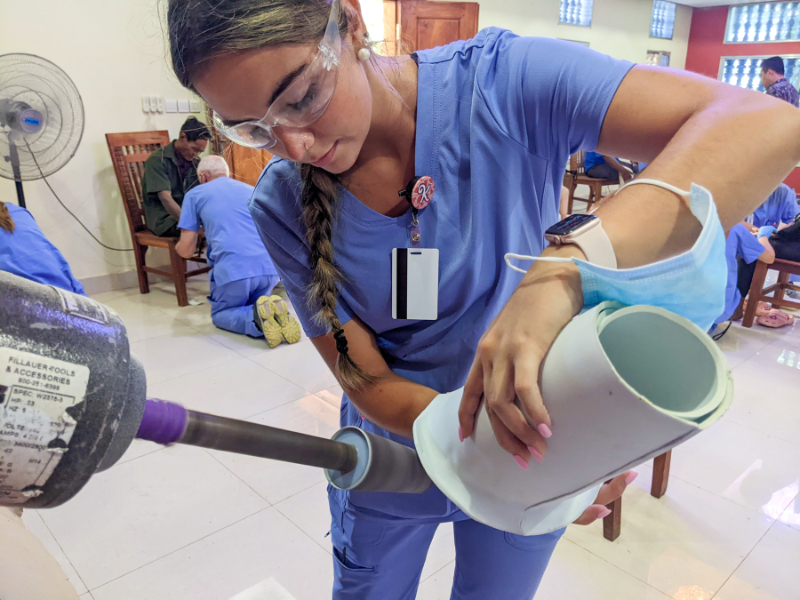A female student working on a prosthetic