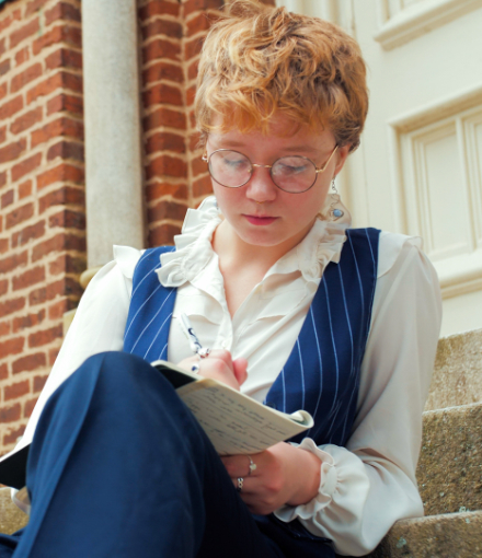 ivy clarke writes in a notebook