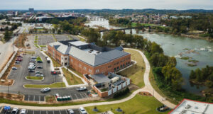 an aerial view of the school of medicine building in columbus, which sits on the banks of a river