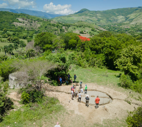 aerial view of people building water tank