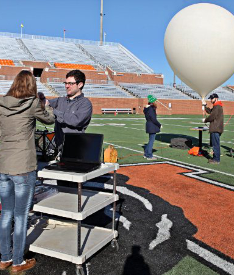 students prepare to launch a weather balloon