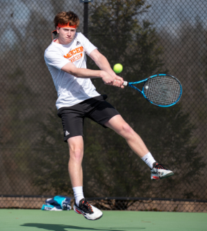 men's tennis player jumps to hit the ball