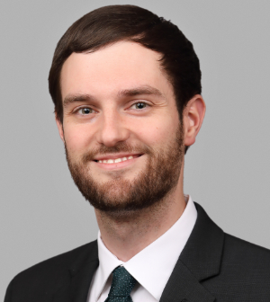 headshot of man in suit