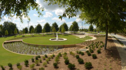 Wide angle photo of a garden and fountain