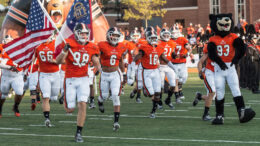 Mercer football team running out on the field