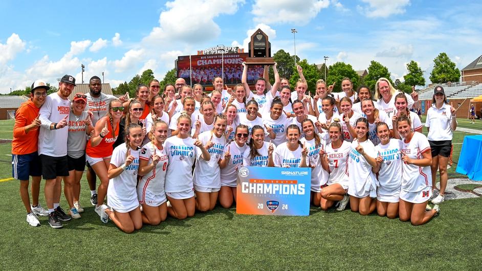 Women's Lacrosse team poses after their 3rd straight Big South Conference Championship win