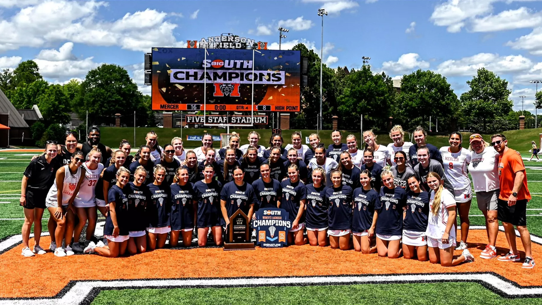 Women's Lacrosse Team poses for photo after winning Big South title