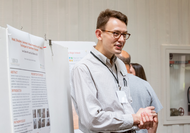 A Mercer student presenting a research poster at the Atlanta Research Conference.