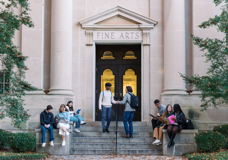 Various students outside of the Fine Arts building