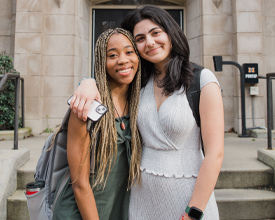 Roommates hugging each other and posing for the camera