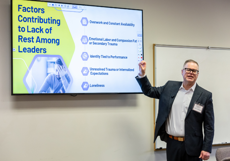 A Mercer student gives a presentation in a classroom.