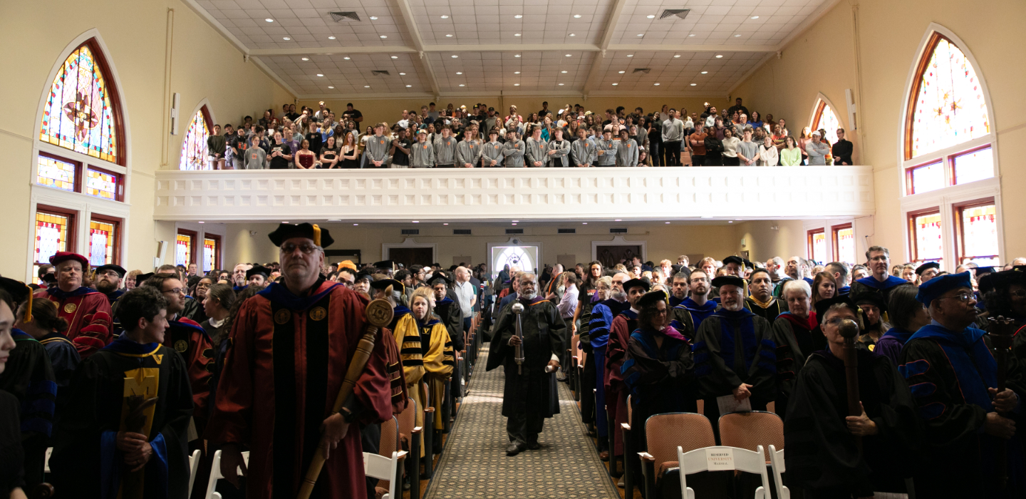 Faculty process into Toney Auditorium for Founders' Day.