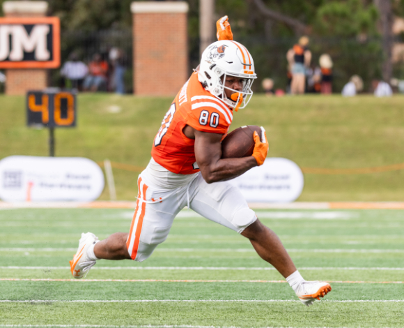 Mercer University football player #80 in orange uniform runs with the ball during a home game.